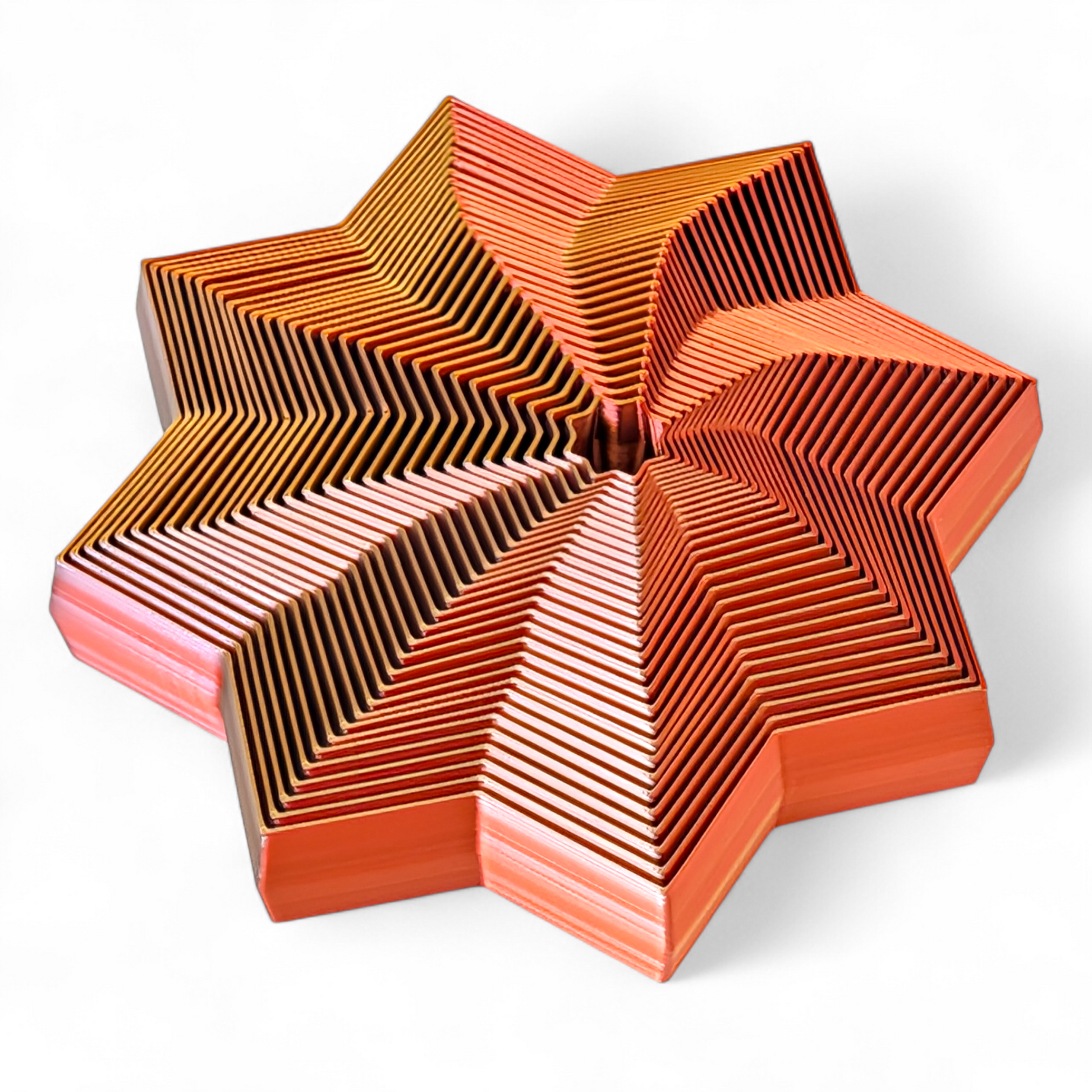 Star-shaped object with a geometric pattern on a white background