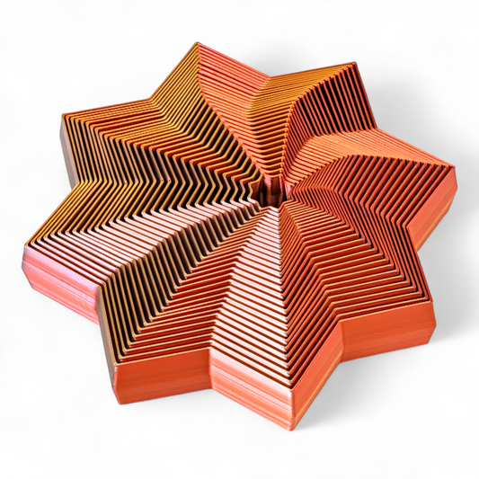 Star-shaped object with a geometric pattern on a white background